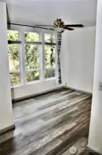 These Floors - looking into the dining room space with large windows overlooking a beautiful landscape