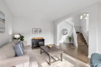 Another angle of the front room. Walk to the left of the stairs to head back to the kitchen.