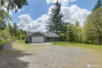 Huge gravel driveway leading to the house, tons of room to park your RV and all your toys.