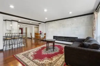 Open floor plan with hardwood floors throughout
