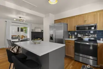 Quartz countertops and Custom hickory cabinets