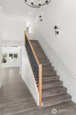 Grand Entry with Laminate hardwood on the stairs