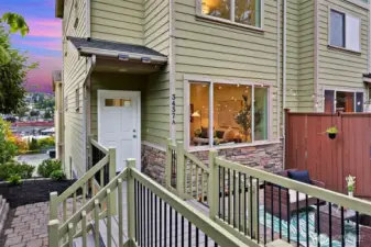 Perched up in hillside, step into the gated courtyard of this corner unit townhome.