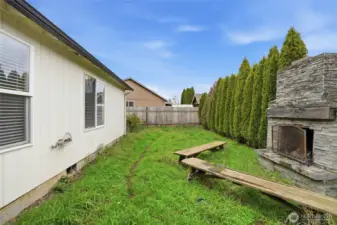 Backyard with outdoor fireplace