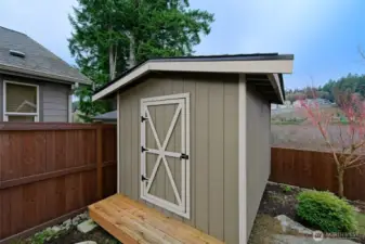 Large custom built shed in the backyard stays!