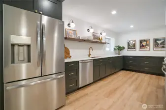 Lower level kitchen w/restoration hardware lighting and tons of cabinet space