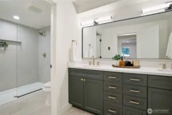 lower level bathroom with dual sinks, heated floors, and 6 ft shower