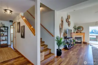 Hallway to prime bedroom, guest half bath, laundry room and garage.