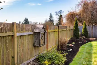 Back of lot is framed by lovely fresh landscaping and is show ready for Spring & Summer backyard gatherings.