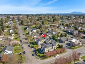 Aerial view of residential neighborhood with a marker indicating the location of the highlighted property.