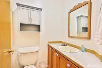 Main Home. Split bathroom. Toilet and sink.