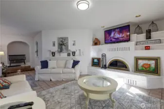 Painted Brick Fireplace with Fan for Heat.