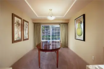 Through the columns is a generously sized formal dining room with large picture window for more of that glorious natural lighting.