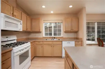 Tons of counter space and lots of cupboards allow for easy kitchen life.