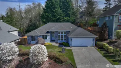 The lovely lines of this multi hipped roof add to the architectural detailing of this charming home.