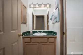 The main/guest bath has a tub/shower combo.