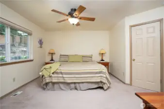 The primary bedroom is located behind double doors and is nice and spacious.  A walk in closet is found behind the single door.