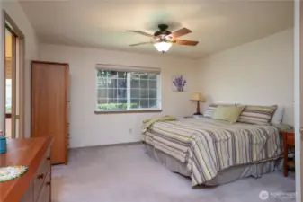 Another view of the primary with the door to the ensuite bathroom shown to the left.