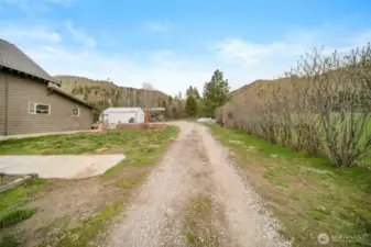 Driveway to the home, shop, and RV Cover. RV cover has hookups.