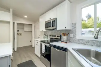 Notice the new stainless steel stove, dishwasher and microwave