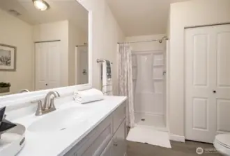 The linen closet is conveniently located in the primary bath.