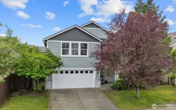 With a 2-car garage, mature landscaping, and excellent curb appeal!