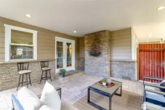Covered outdoor patio great space for grilling, and relaxing.