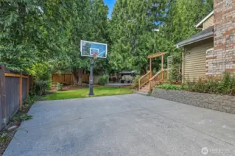 An additional paved sport court area provides the perfect space for basketball, scooters, or extra play, making great use of the home’s expansive 10,543 sq ft lot.