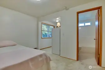 Bedroom #3 with full bath. Can act as it's own studio apartment with second sink, fridge and access to outside.
