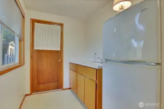 Backdoor access and second kitchen in bedroom #3.