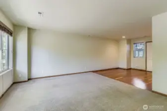 Living room open to the dining room and has abundant natural light. Bright and light!
