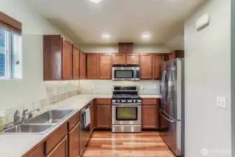 The kitchen window overlooks the mature landscaped courtyard. Your back door entrance.