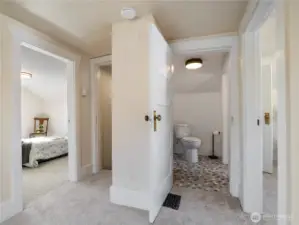 The top floor has two bedrooms, a book nook, and a half bath.