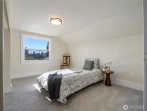 This is the bedroom on the top floor that is facing the front of the home.