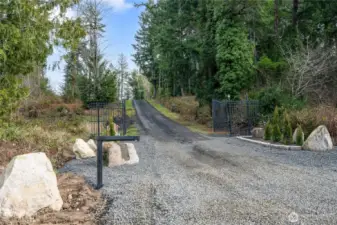 Your new estate welcomes you in via a new steel privacy gate! The luxurious entry implies the elegance to be found throughout this amazing property and home. Feels so very private and rural, yet shopping and town are mere minutes away.