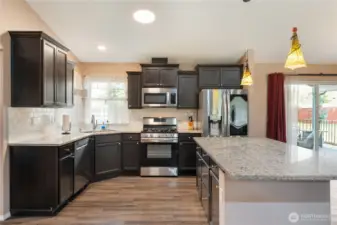 This home and kitchen flow seamlessly to the expansive deck and private portion of the backyard. What a fabulous and private location to entertain or just to celebrate life every day!