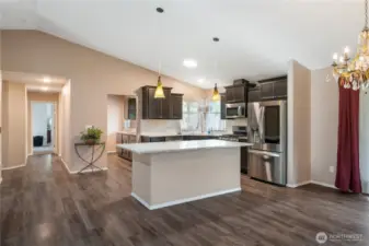 Everything is gleaming and light and bright, and the soaring vaulted ceilings and expansive living spaces provide a sense of spaciousness and elegance inside and out!