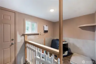 Near the private entrance to the potential ADU section of the home is an enclosed area for dogs who might come in wet from the secure dog run just outside. Paint is in process of being touched up. How will you use this great space?