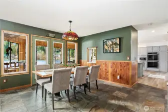 Dining room, with French doors that open into the sunroom.