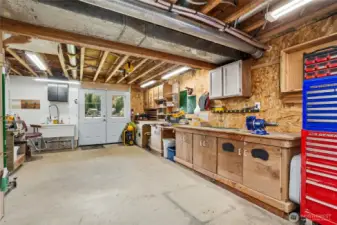 Downstairs bonus space/shop. Double doors that open to the lake. Plumbed with utility sink.