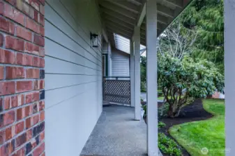 Pathway to front door with beautiful landscaping adding privacy