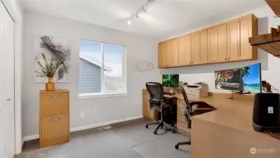 This upstairs guest bedroom has been used as a fully functional office area