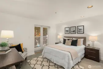 Owners bedroom with modern concrete flooring, new Milgard French Doors.