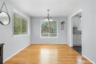 Formal dining room with large windows proving an abundance of natural light.