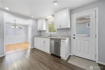 Spacious kitchen with door out to the side deck.