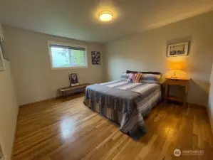 Pretty floors and views from this bedroom.  Built ins too.