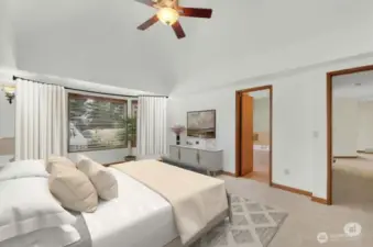 Spacious primary suite with bay windows.