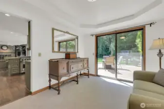 Former dining space is now a cozy sitting room with easy deck access.