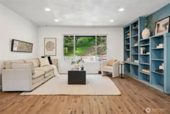 Living room with natural light and a view of the back yard