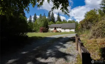 The home is set off the road with a long driveway for ultimate privacy.